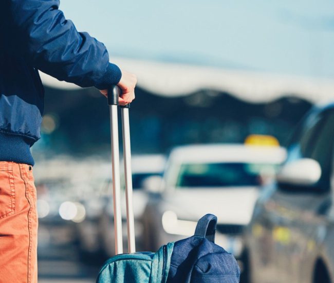 Airport taxi. Passenger is waiting for taxi car.