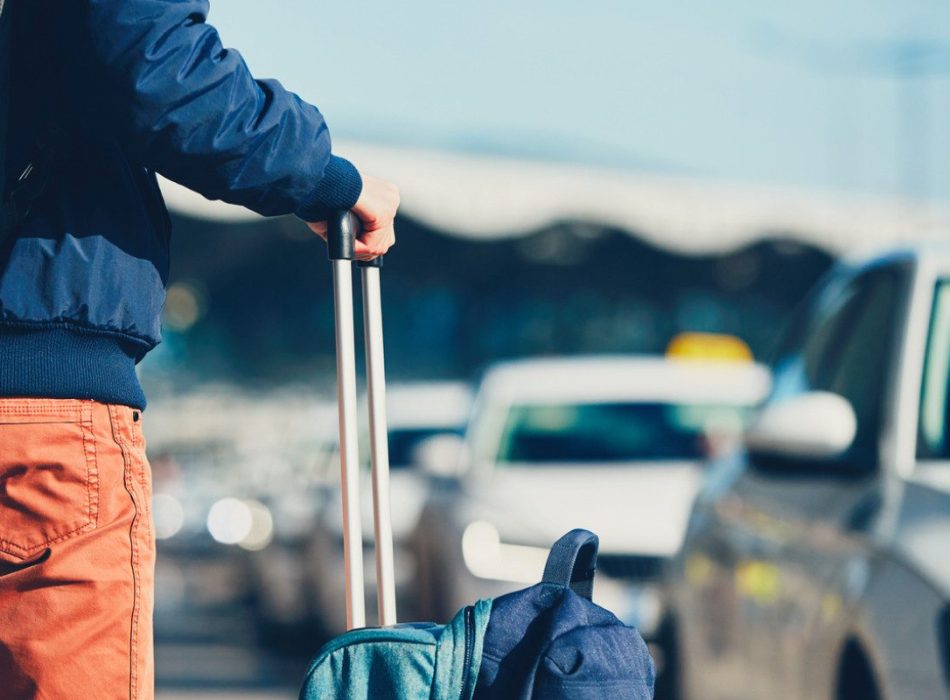 Airport taxi. Passenger is waiting for taxi car.